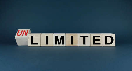 Limited or Unlimited. Cubes form the choice words Limited or Unlimited. Extensive concept of limit to unlimitedの写真素材