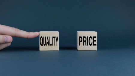 Price - quality. The cubes form the choice words Price or Quality. Business concept of choosing between price or qualityの写真素材