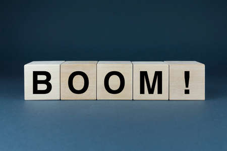 boom sign. Cubes form the word Boom. An extensive concept of the word Boom ranging from explosion, social problems to humorの写真素材