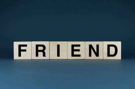Friend. Cubes form the word Friend. friends and friendship conceptの写真素材