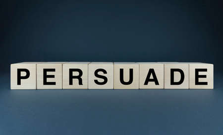 Persuade. The cubes form the word Persuade. An extensive concept of the word Persuade used in various areas of business and lifeの写真素材