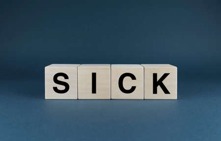 Sick. Cubes form the word Sick. An extensive medical concept of the word Sick in mental and physical termsの写真素材
