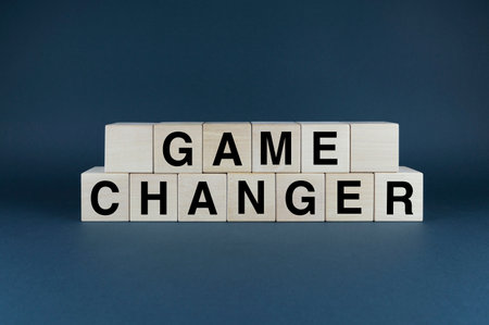 game changer. Cubes form the word game changer. Game changer business or political change concept and disruptive innovationの写真素材