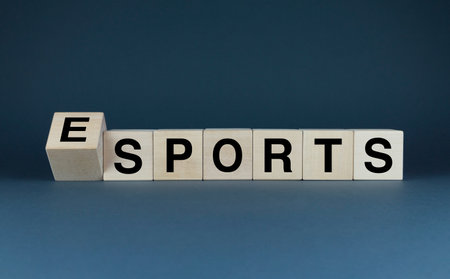 Esports or Sports. Cubes form the words Esports or Sports. The concept of eSports in games and not onlyの写真素材