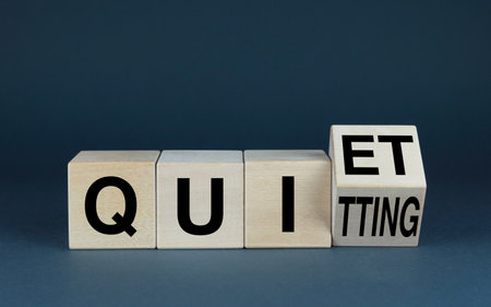 Quiet Quitting. Cubes form the word Quiet Quitting. Extensive Business Concept Quiet Quitting related to work and attitude to itの写真素材