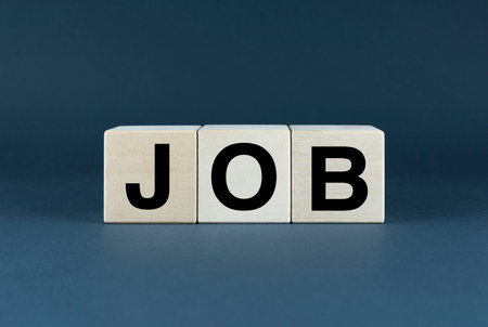 A close-up of wooden blocks spelling the word JOB. This image can be used for concepts related to work, career, employment, and businessの写真素材