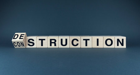 A conceptual image symbolizing the cyclical nature of life, where destruction often precedes creation. The blurred boundary between the two words highlights the interconnectedness of these processes.の写真素材