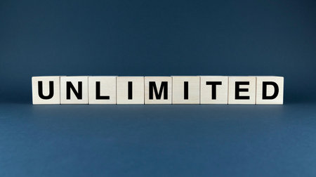 Image of wooden blocks spelling out the word unlimited. The blocks are arranged in a way that suggests freedom from constraints and limitationsの写真素材