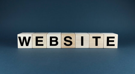 Wooden blocks spelling out the word WEBSITE. Perfect for presentations, marketing materials, or any project related to web design, development, and online businessの写真素材