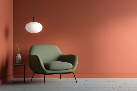 A cozy green armchair and a small side table in a room with terracotta walls. This modern interior showcases a simple yet elegant contemporary design aesthetic.の素材