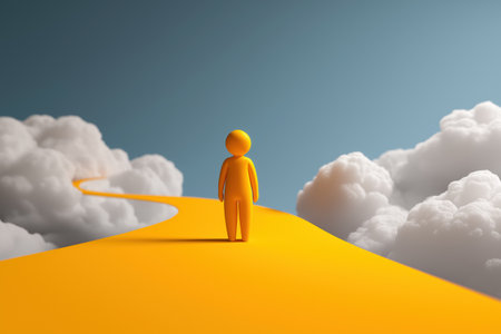 A yellow character stands at the beginning of a long, winding yellow road that stretches into the clouds, representing a personal journey, career path, and future.の素材