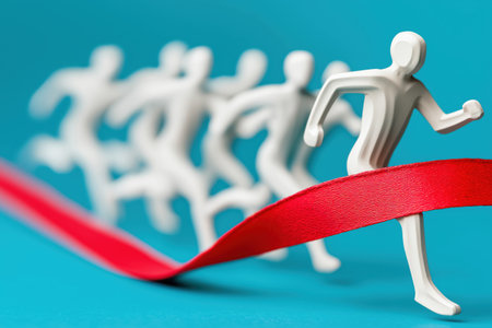 An abstract white figure runs across a red finish line ahead of other competitors, symbolizing success, victory, and winning in business competition.の素材