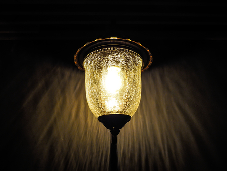 Decorative wall lantern on dark backgroundの写真素材