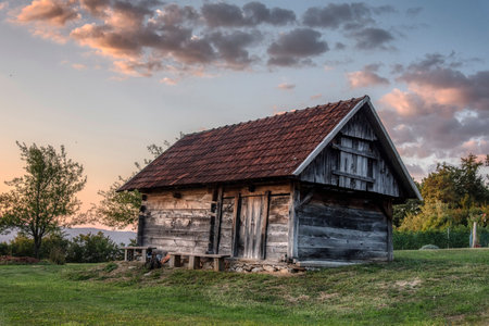 Beautiful sunset in the vineyard of the village with a wooden house, Dolenjska Slovenijaの写真素材