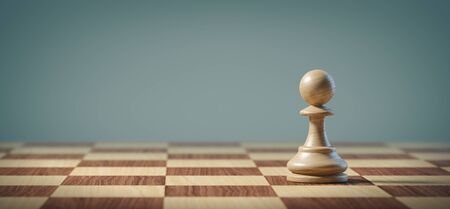 White pawn on a chessboard. Business, strategy and leadership concept.の写真素材