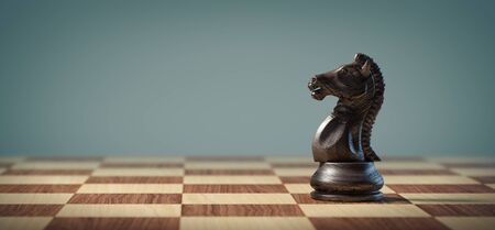 Black knight on a chessboard. Business, strategy and leadership concept.の写真素材