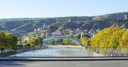 View at Bridge of Peace, Narikala fortress and Tbilisi old town, Georgia. Beautiful sunny autumn...
