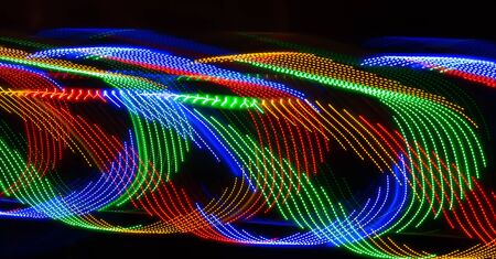 Play on light with swirls of blue green red