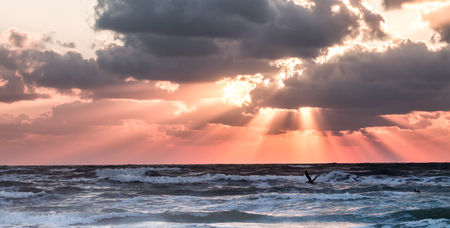 golden Sunrise peaking through the clouds over the Gulf of Mexico