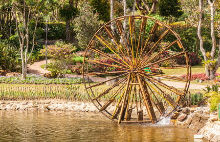 Bamboo water wheel. The use of water power for irrigation at far areaの写真素材