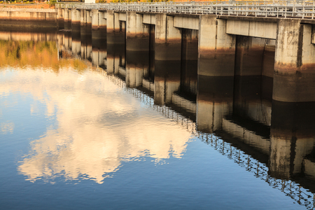 Water rushing through gates at a dam in Kanchanaburi provinceの写真素材