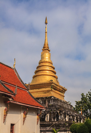 Beautiful golden pagoda with blue sky, Thailandの写真素材