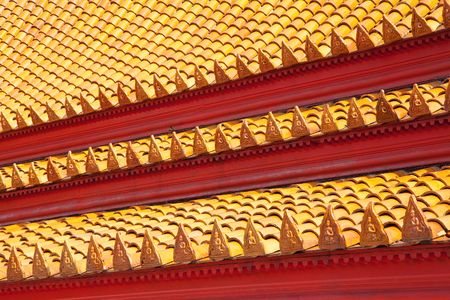 Colorful patterned tiles of the roof of the temple in Thailand.の写真素材