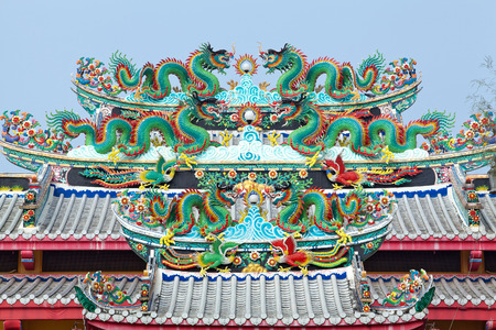 Chinese dragon statue on the roof of the Chinese temple in Thailandの写真素材