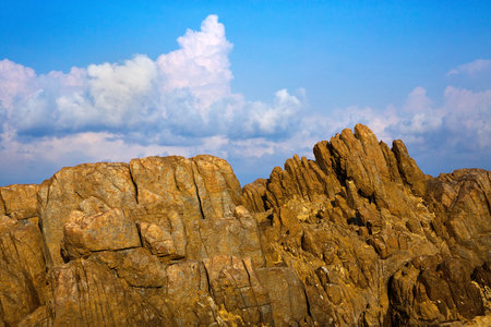 Rocks and sky with beautiful clouds.の写真素材