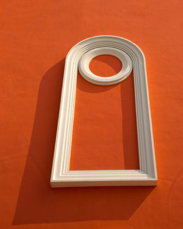 White frame on red orange wall.の写真素材