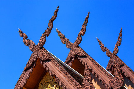 Pattern of wooden gable in Thailand temple.の写真素材