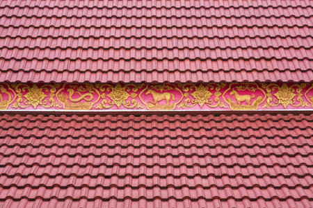 Tile roofs of temples in Thailand.の写真素材