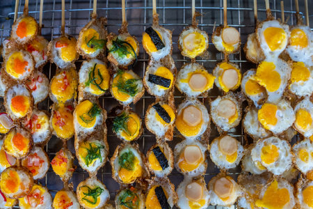 Colorful fried quail eggs with tasty seasoning