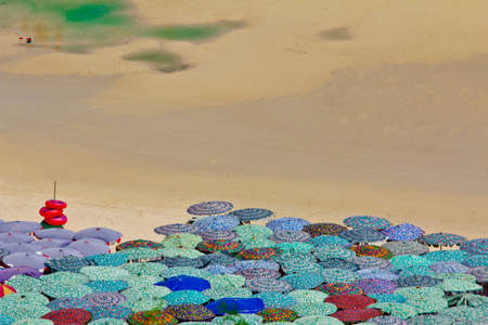 beach umbrellas on summer hot day
