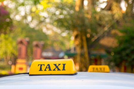 yellow taxi  sign in yangon, myanmarの写真素材
