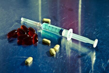 Medical and syringe on metal blackgroundの写真素材