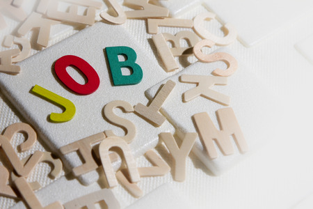 Jobs search concept, colourful wooden text word "Jobs"の写真素材