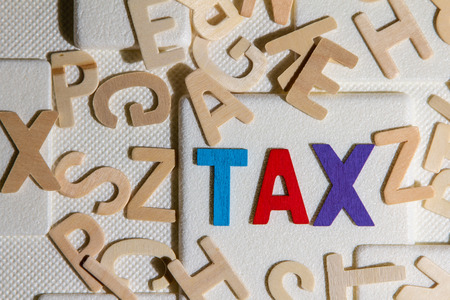 TAX concept, colourful wooden text wordの写真素材