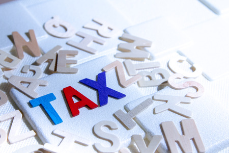 TAX concept, colourful wooden text wordの写真素材