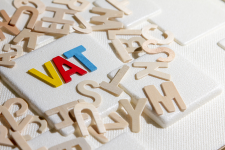 VAT (Value Added Tax) concept. Word "VAT" alphabet made from woodの写真素材