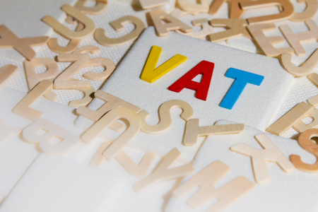 VAT (Value Added Tax) concept. Word "VAT" alphabet made from woodの写真素材