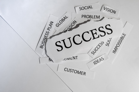Torn newspaper headlines depicting business successの写真素材