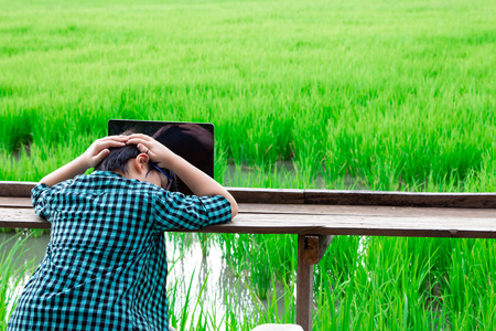 boy and laptop, young student looking laptop and unhappy,Education conceptの写真素材