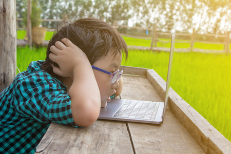 boy and laptop, young student looking laptop and unhappy ,Education conceptの写真素材