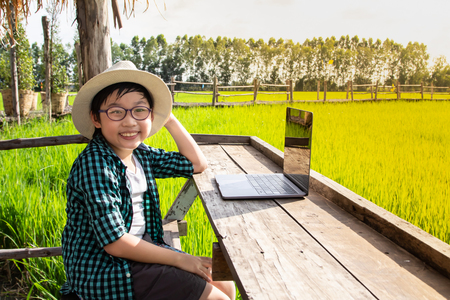 boy and laptop, young student smiling and  using laptop ,Education conceptの写真素材
