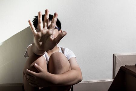 A boy hand of signal to stop,A fearful child, violence and aggression concept.の写真素材