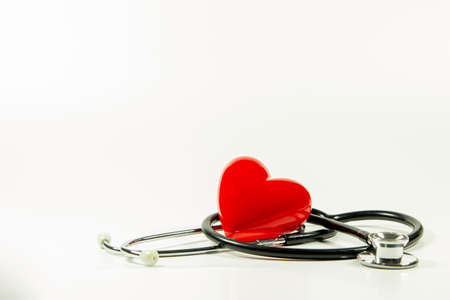 Red heart and a stethoscope on isolated white background.の写真素材