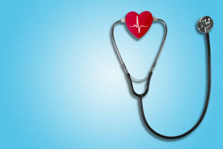 Red heart and a stethoscope on isolated backgroundの写真素材