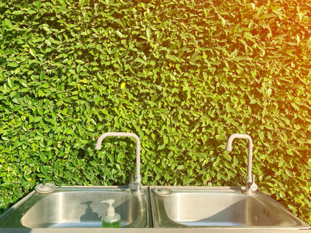 Aluminum Sink and tree wall background .の写真素材