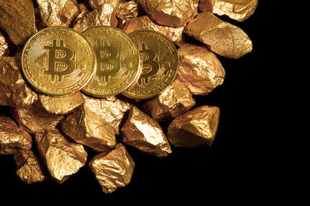 Golden Bitcoin Coin and mound of gold. Bitcoin cryptocurrency. Business concept.の写真素材